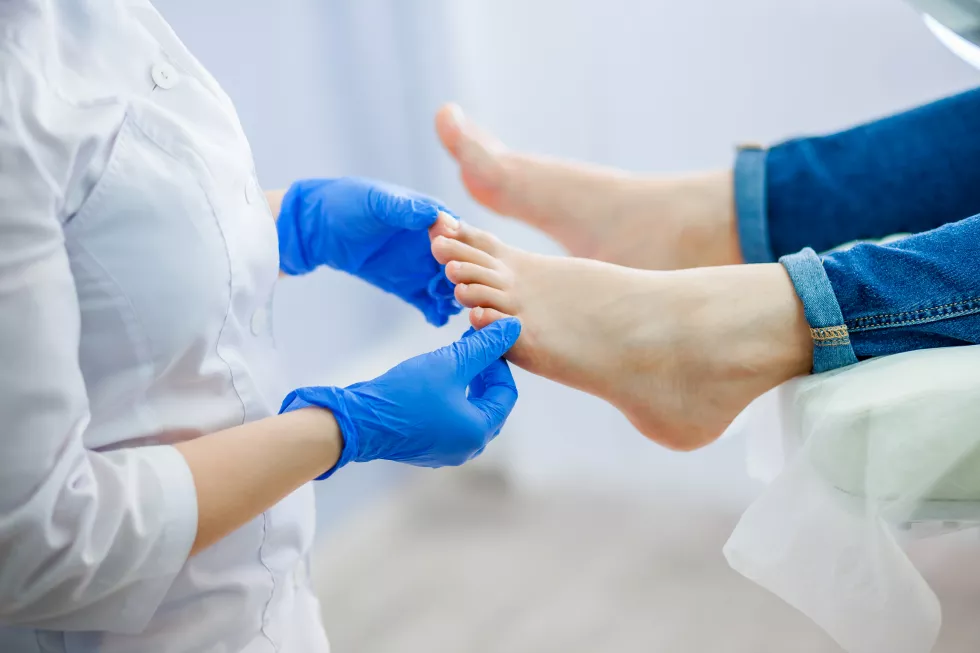 podiatry-doctor-examines-foot