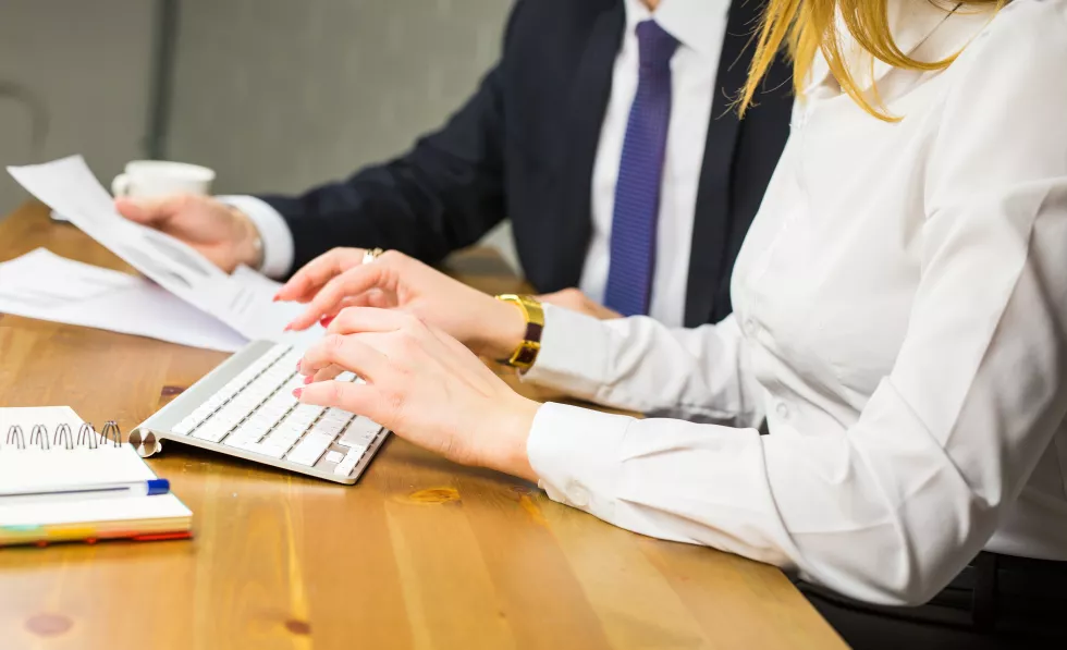 rear-view-people-sitting-table